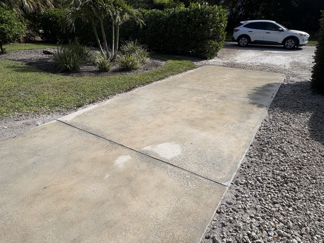 Concrete driveway cleaned by media blasting in Naples