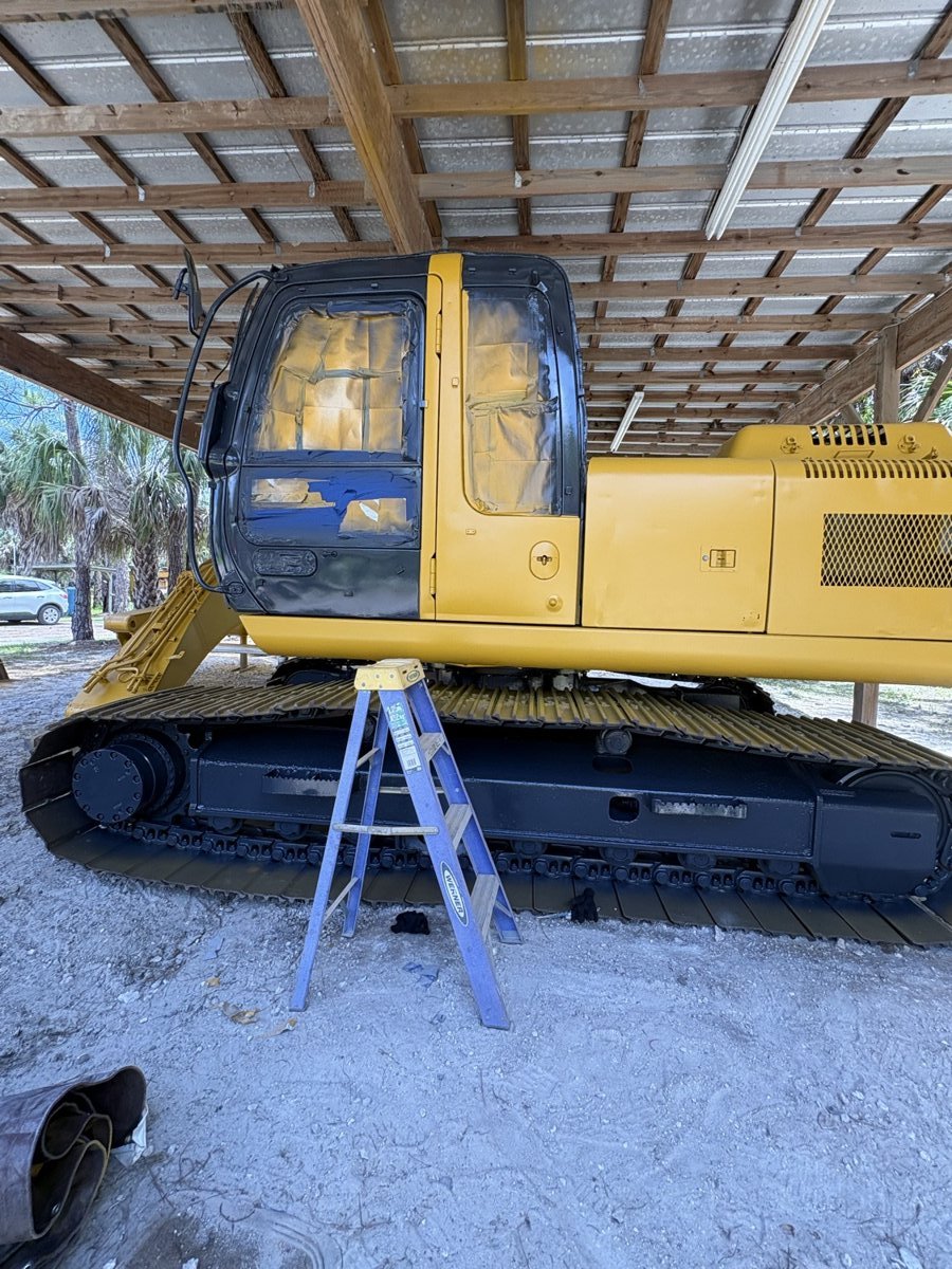 Heavy equipment excavator masked for blasting